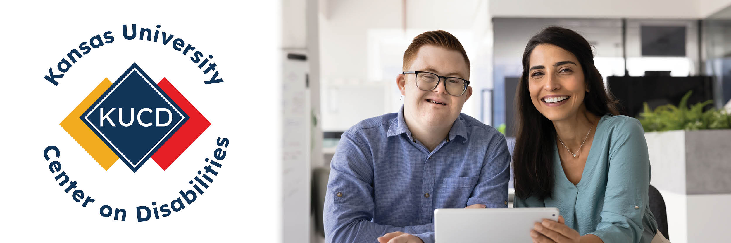 Kansas University Center on Disabilities, two people smiling at the camera, one person is holding a tablet.